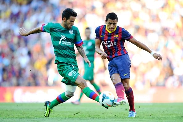 Alexis Sanchez of FC Barcelona duels for the ball with Ruben Garcia Santos of Levante UD during the La Liga match between FC Barcelona and Levante UD at Camp Nou